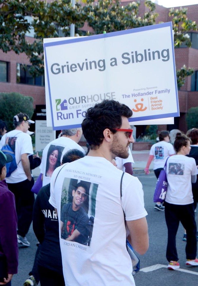 young man with grief sign.jpg